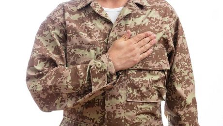 military person with hand over heart