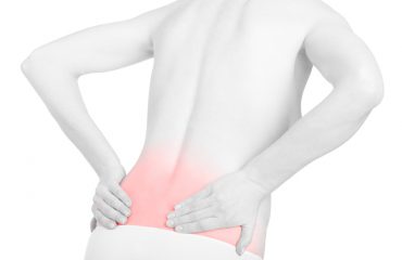 Young adult woman with back pain